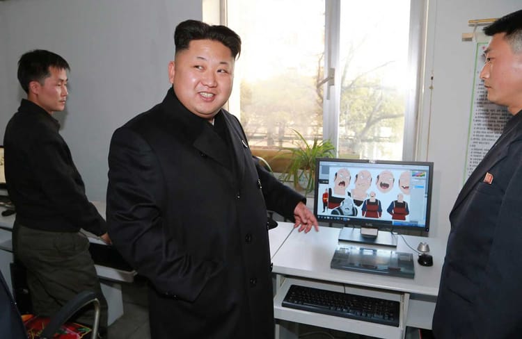 North Korean leader (Kim Jong Un) pointing to animations on a screen.